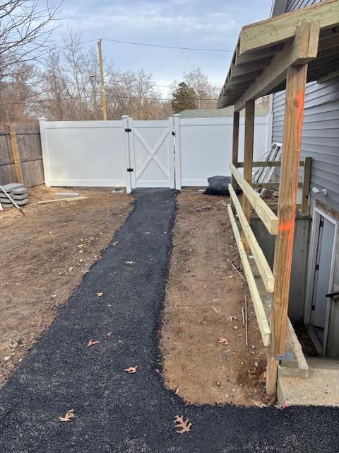 view of yard with a gate and fence