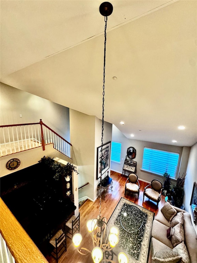 living room with wood finished floors and stairs