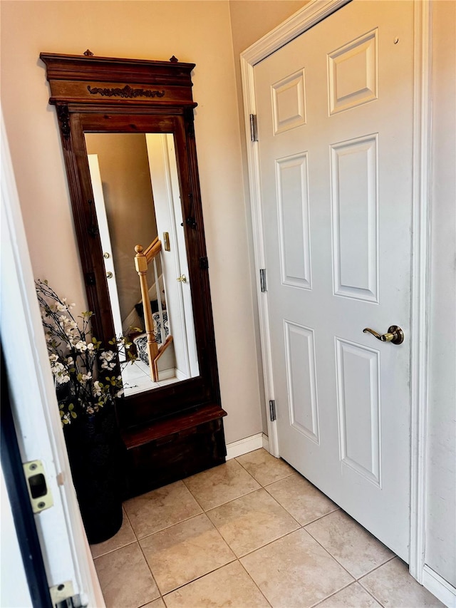 entryway with light tile patterned floors