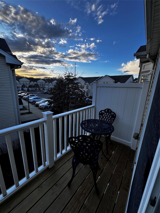 deck at dusk with a residential view