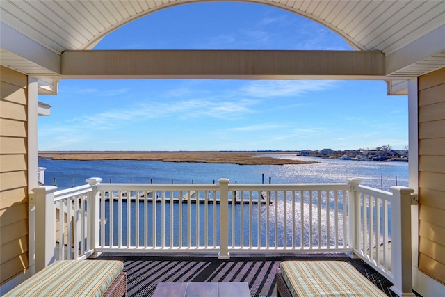 deck featuring a water view