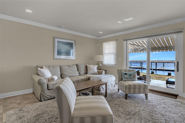 living room with a water view, baseboards, visible vents, and ornamental molding