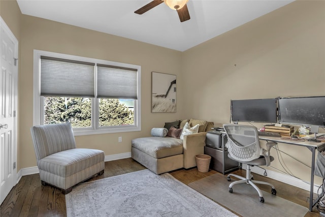 office space with a ceiling fan, baseboards, and wood finished floors