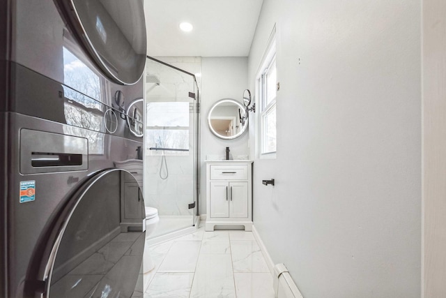 bathroom featuring baseboards, a baseboard radiator, marble finish floor, a shower stall, and recessed lighting