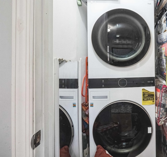 laundry area featuring laundry area and stacked washing maching and dryer