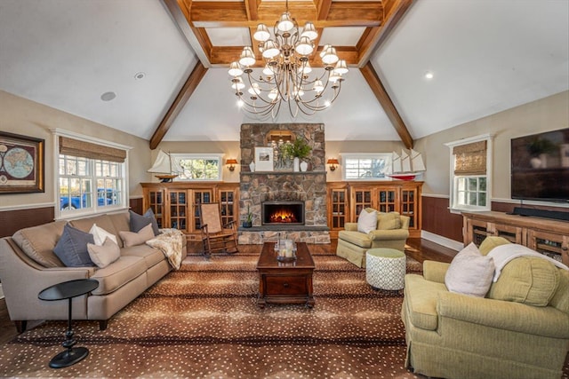 living area featuring a wainscoted wall, beamed ceiling, a stone fireplace, wood finished floors, and high vaulted ceiling