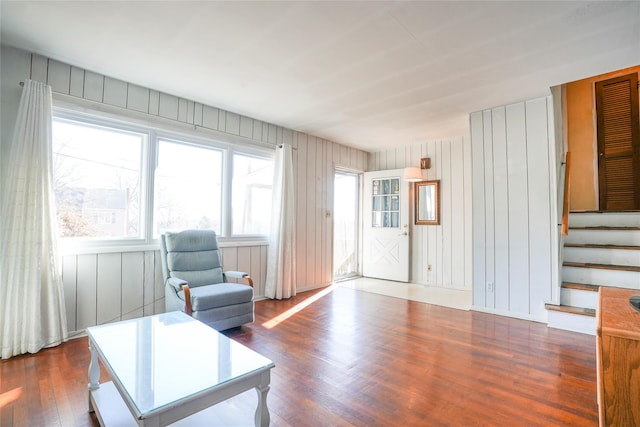 living room featuring stairway and wood finished floors