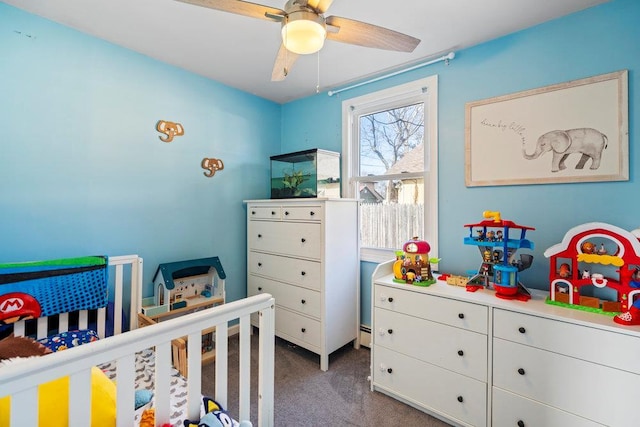 carpeted bedroom featuring a nursery area