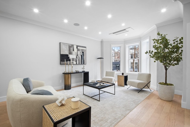 living room with recessed lighting, baseboards, light wood-style floors, and ornamental molding