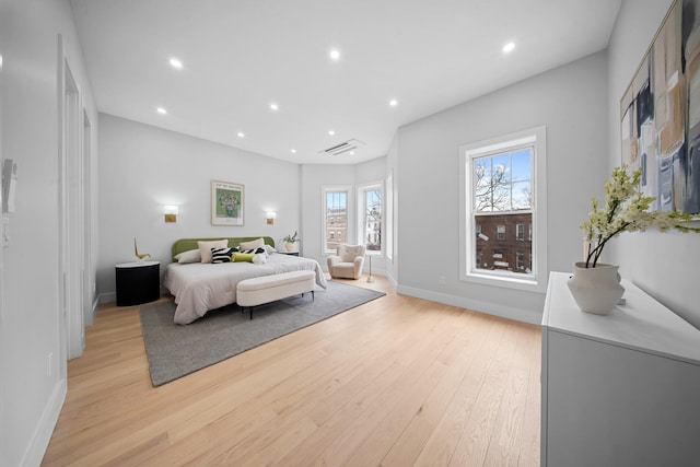 bedroom with recessed lighting, baseboards, and light wood-style flooring