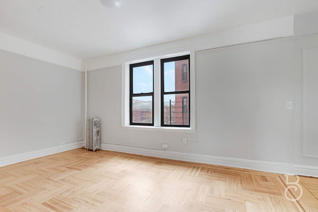 37-16 83rd St Unit 4E, Jackson Heights, NY 11372 - empty room with radiator and baseboards