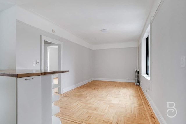 37-16 83rd St Unit 4E, Jackson Heights, NY 11372 - empty room with radiator heating unit and baseboards