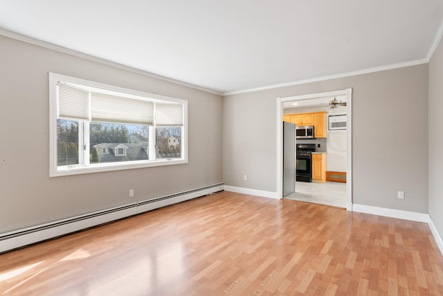 empty room with a baseboard heating unit, baseboards, crown molding, and light wood finished floors