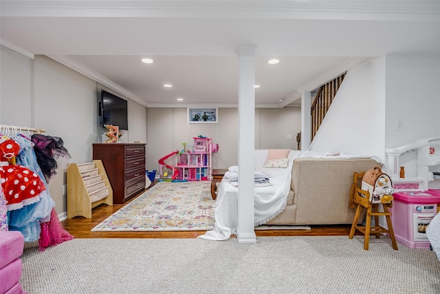 playroom with ornamental molding, recessed lighting, and carpet floors