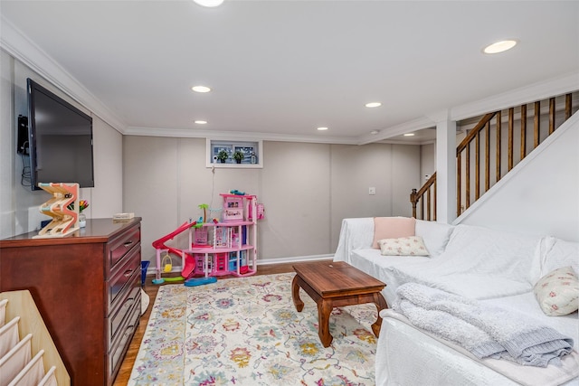 interior space featuring ornamental molding, wood finished floors, and recessed lighting