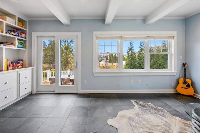 doorway with beam ceiling and baseboards