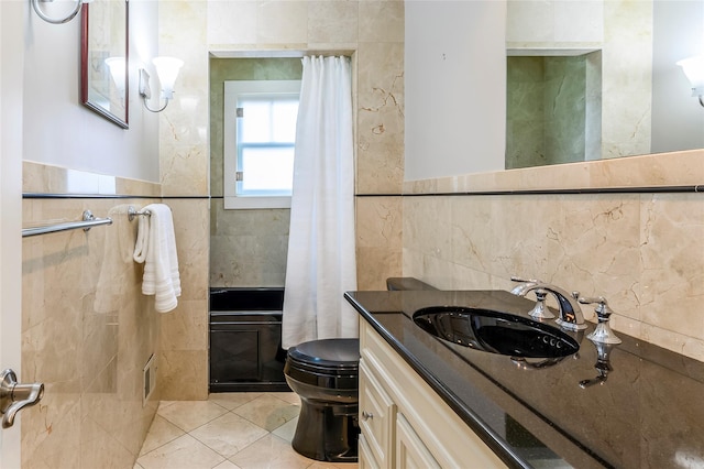 full bathroom with a shower with shower curtain, tile walls, toilet, and tile patterned floors