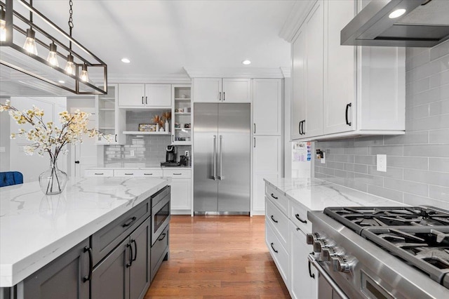 kitchen with range hood, open shelves, gray cabinets, white cabinets, and built in appliances