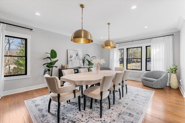 dining area with light wood-type flooring, baseboards, crown molding, and recessed lighting