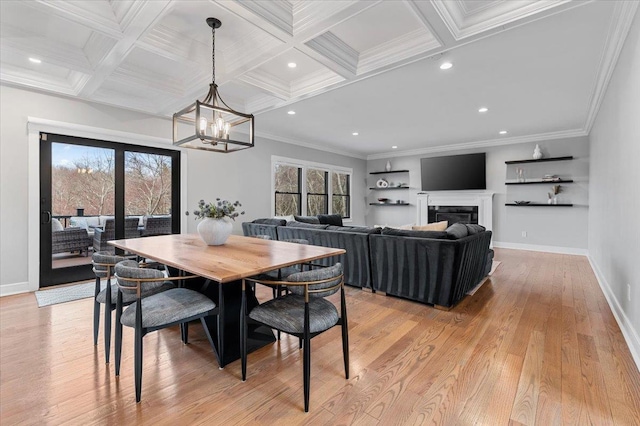 dining room with light wood-type flooring, ornamental molding, coffered ceiling, and beamed ceiling