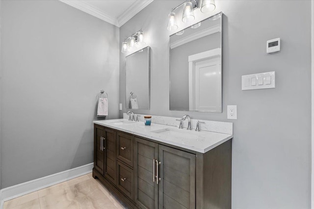 full bath with double vanity, baseboards, ornamental molding, and a sink