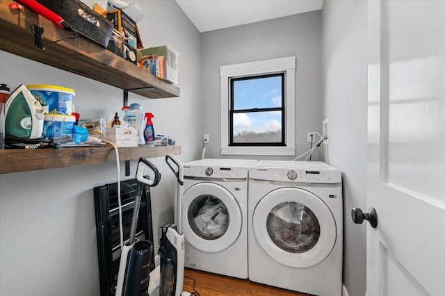 laundry room with laundry area and washing machine and clothes dryer