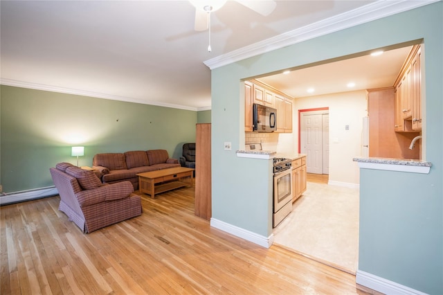 living room with a baseboard radiator, light wood-style flooring, ornamental molding, a ceiling fan, and baseboards