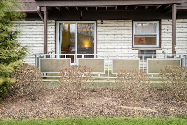 exterior space with brick siding