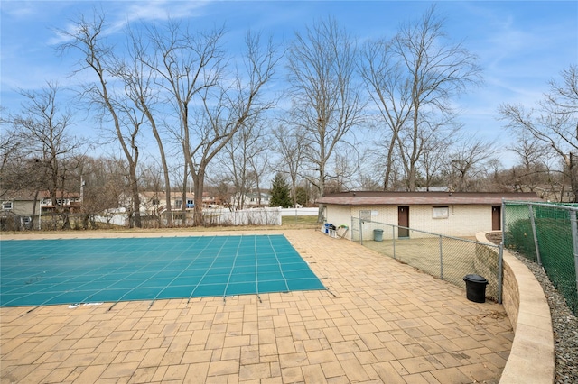 view of pool with a patio area and fence