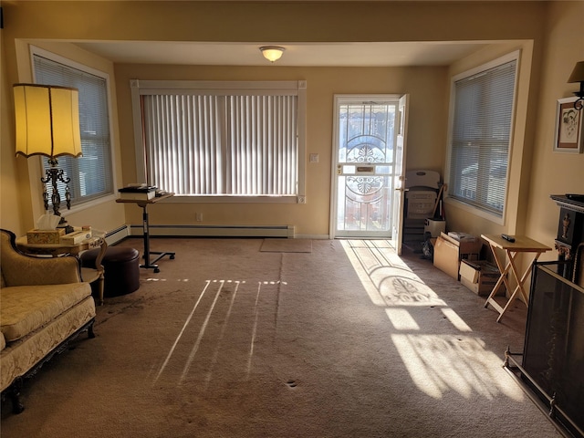 foyer with carpet floors and a baseboard radiator