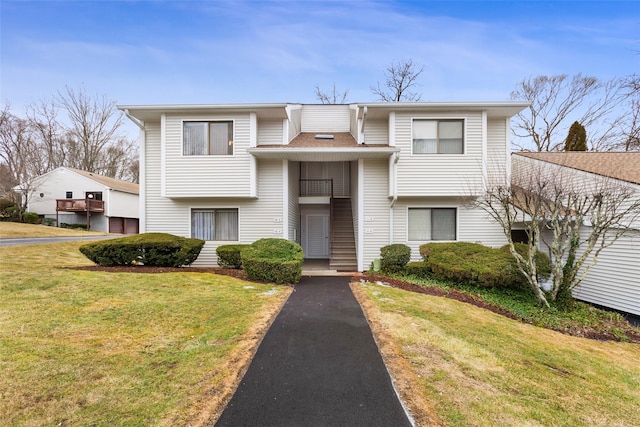 raised ranch with a front lawn