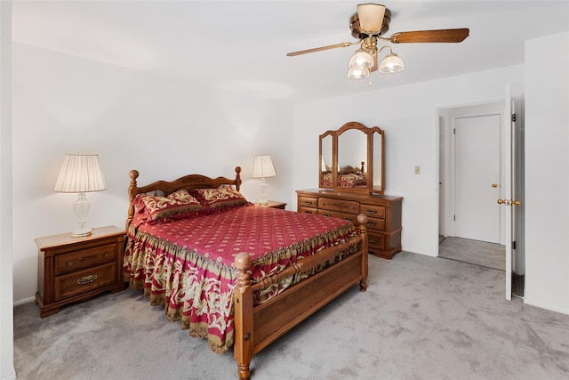 bedroom featuring light carpet and ceiling fan