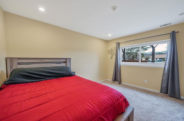 bedroom featuring carpet floors, recessed lighting, visible vents, and baseboards