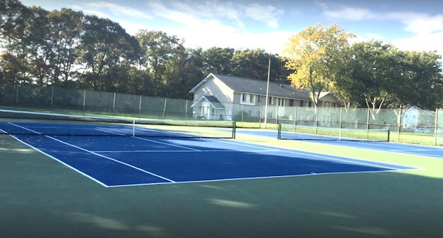 view of sport court with fence