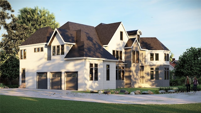 view of front facade with a front yard, driveway, and an attached garage