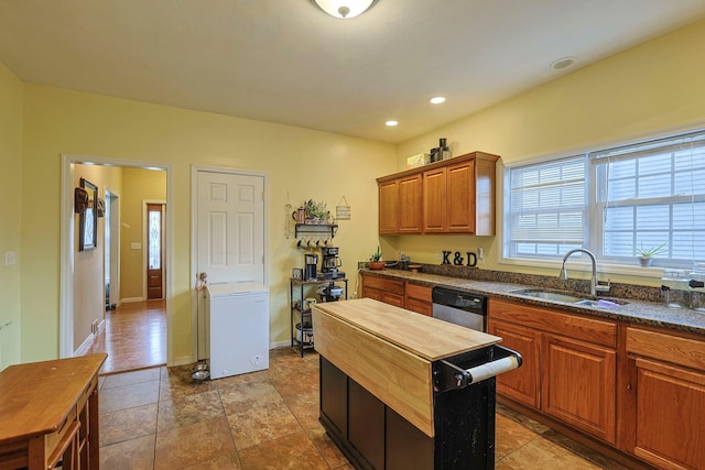 kitchen featuring recessed lighting, a sink, baseboards, wooden counters, and stainless steel dishwasher