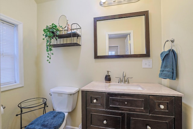 half bath with vanity and toilet