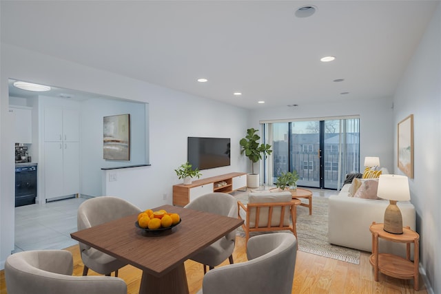 dining room featuring light wood finished floors and recessed lighting