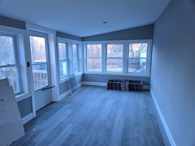 unfurnished sunroom featuring lofted ceiling