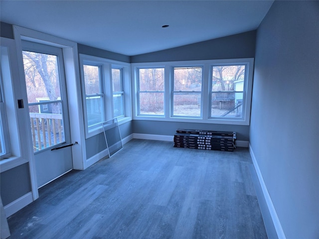 unfurnished sunroom with lofted ceiling