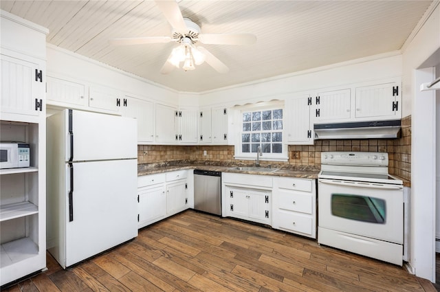 kitchen with under cabinet range hood, a sink, white appliances, white cabinets, and dark wood-style flooring