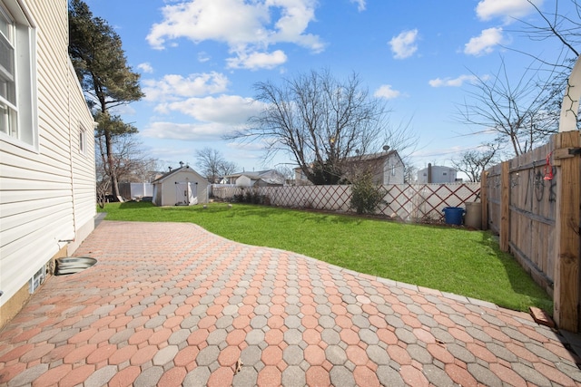 view of patio / terrace with a fenced backyard and an outdoor structure