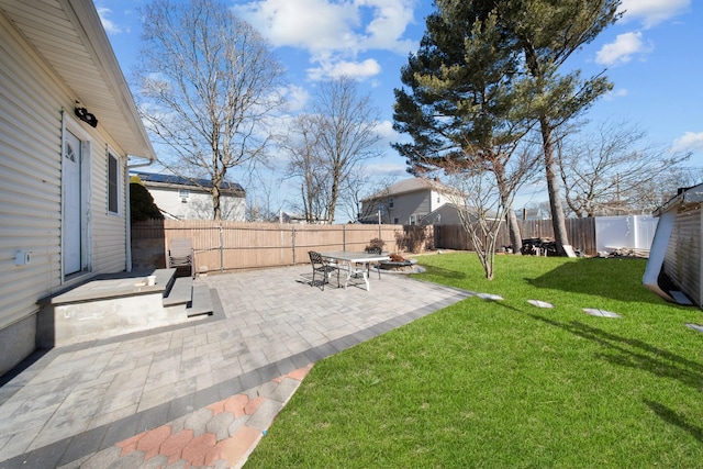 view of yard with a patio and a fenced backyard