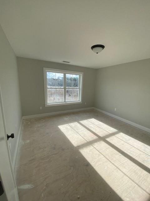 empty room with baseboards