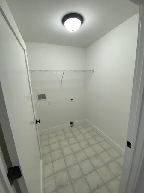 washroom with laundry area, hookup for a washing machine, electric dryer hookup, and baseboards