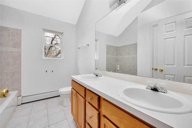 full bath featuring vaulted ceiling, a sink, baseboard heating, and tile patterned floors