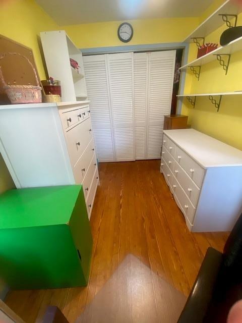 bedroom with a closet and wood finished floors