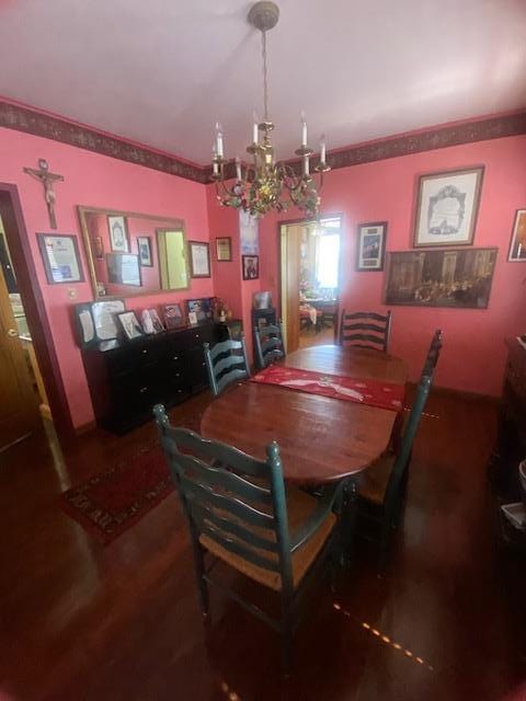 dining space with an inviting chandelier