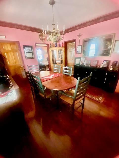 dining space with a notable chandelier