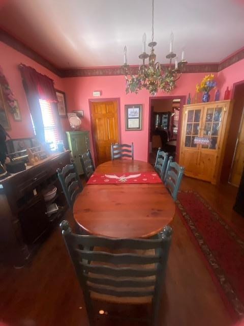 dining area featuring an inviting chandelier